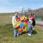 Ambassador Karran with a family at the kite flying event in the Washington DC Metro area