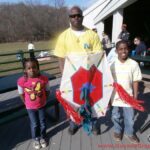 A dad and his kids at the kite flying event in Washington DC Metro area