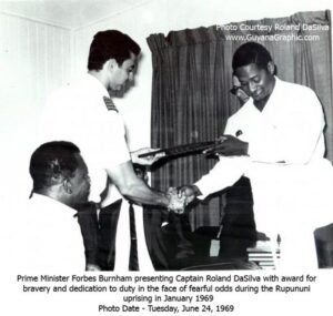 President Forbes Burnham presenting Captain Roland DaSilva with the Cacique Crow of Valor for bravery and dedication to duty in the face of fearful odds during the Rupununi uprising in January 1969