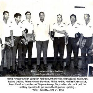 Prime Minister Linden Forbes Sampson Burnham and members of Guyana Airways CorporationL-R - Albert Isaacs, Fazil Khan, Roland DaSilva, Prime Minister Burnham, Phillip Jardim, Michael Chan-A-Sue, Louis Crawford