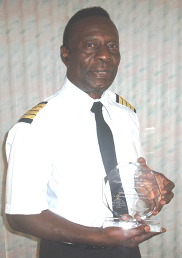 Captain Lloyd Marshall with his award for “Sterling contribution to the development of aviation in Guyana" from the GCAA