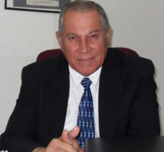 Former AG Bernard De Santos
