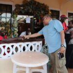 Ministers Raphael Trotman and Simona Broomes meeting with residents during a 'walkabout' in Mahdia