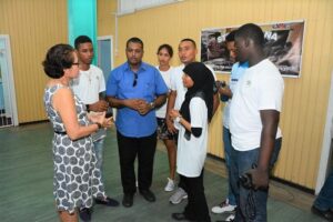 First Lady, Mrs. Sandra Granger chatting with the group of young innovators