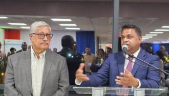 Minister of Public Utilities and Aviation Deodat Indar and Chairman of Demerara Distillers Limited Komal Samaroo