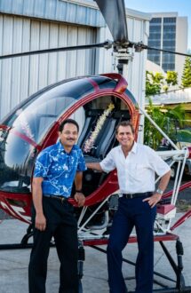 Michael Pacheco with his co-founder Clarence Kanai of Hawaii International Helicopters and one of their first Hughes 300 helicopter