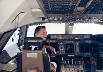 Captain Michael Pacheco in his seat on the Boeing 747-400